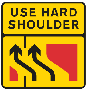 Traffic lanes move across to the left, making use of the hard shoulder. Drivers are guided by temporary road markings or yellow road studs
